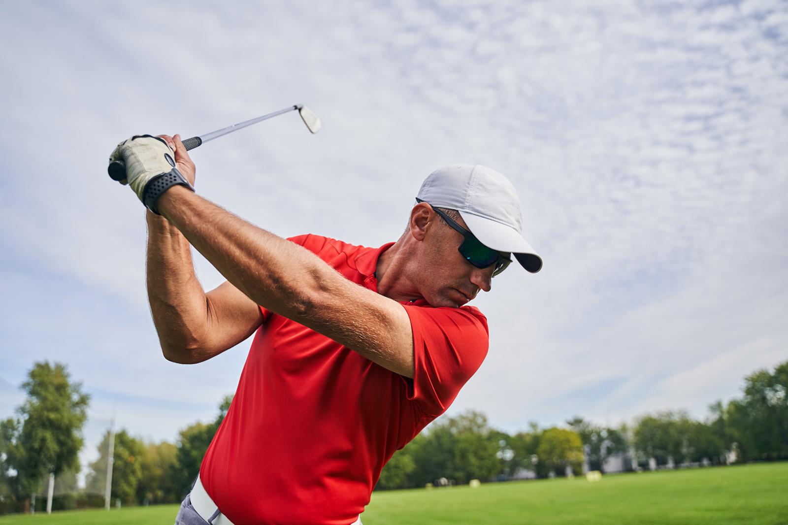 Golfer mid-swing