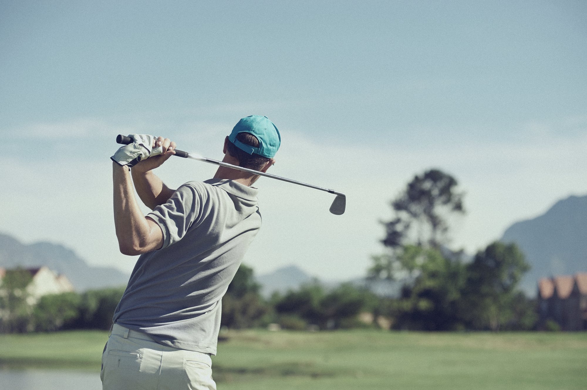 Golfer following through on an iron shot